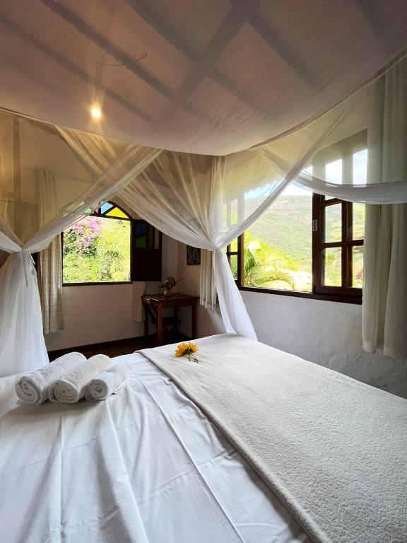 Cama ou camas em um quarto em Pousada do Capão Chapada Diamantina