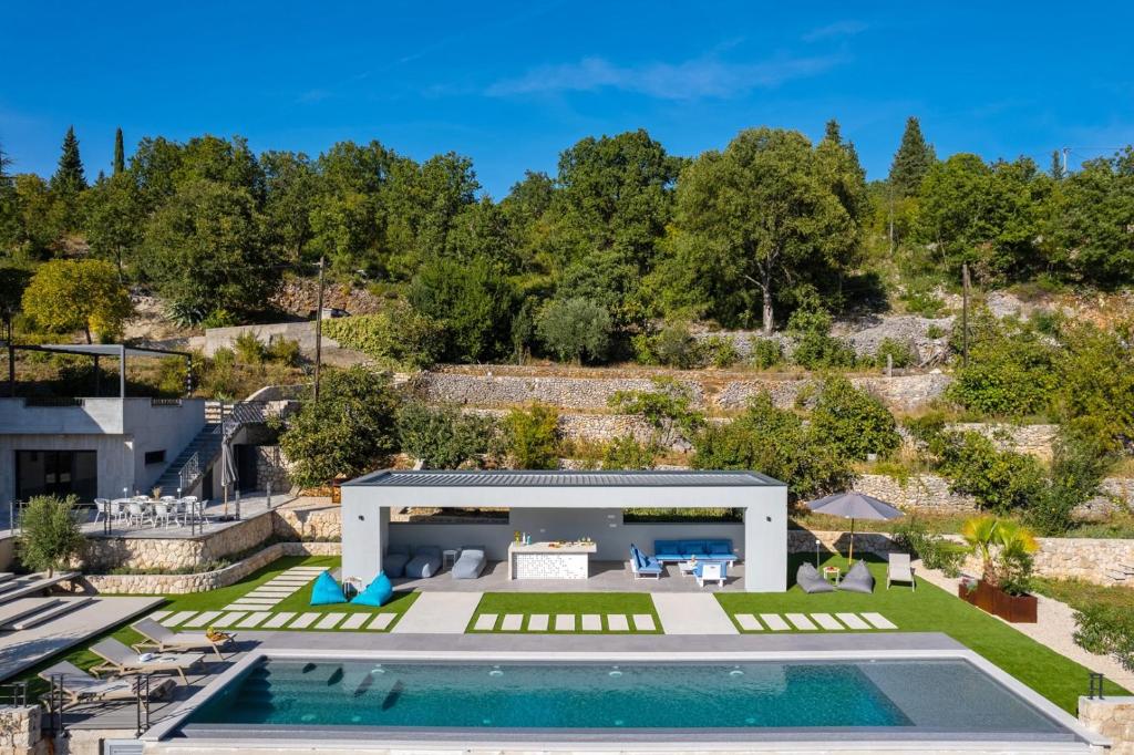 an aerial view of a villa with a swimming pool at Luxury Villa Depollo in Donji Vinjani