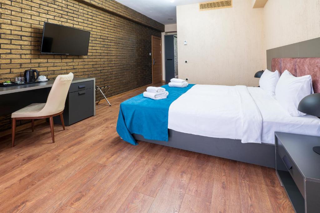 Postel nebo postele na pokoji v ubytování Jazz Hotel