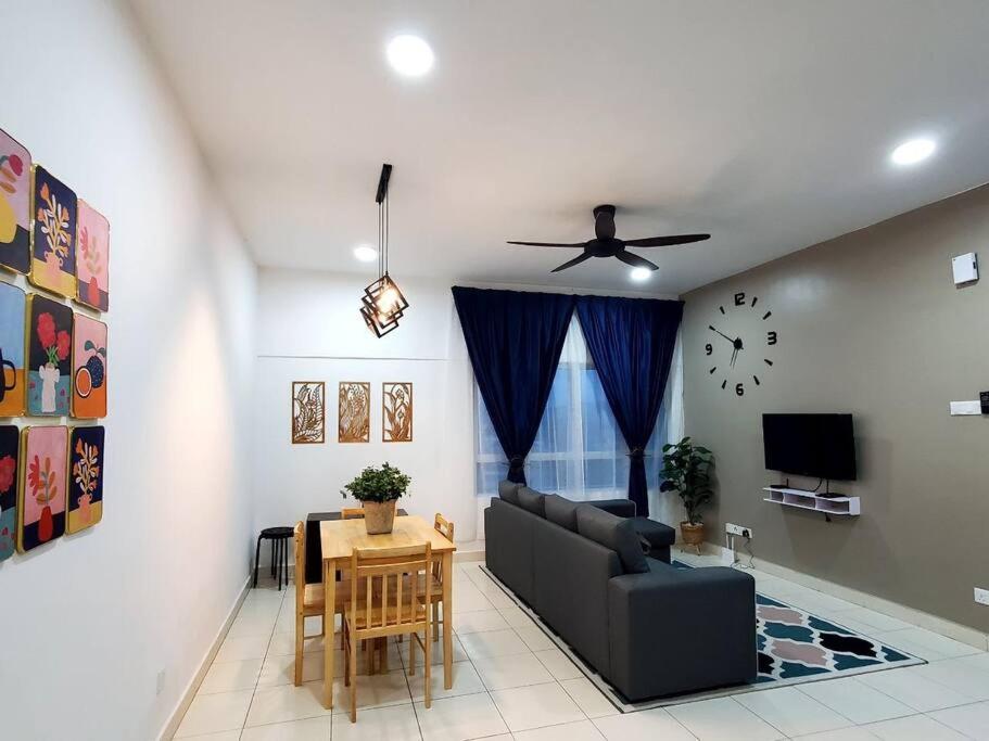 a living room with a couch and a table at Adinda Homestay @ RPB Hospital, Ipoh in Ipoh