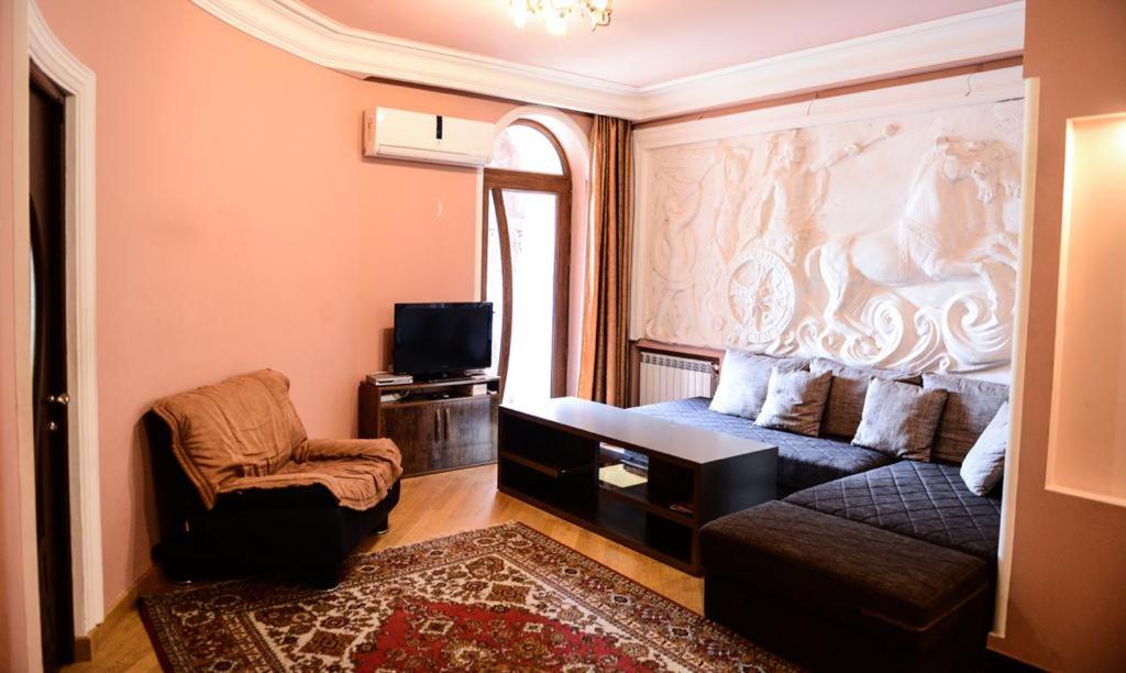 a living room with a couch and a chair at Josefin Apartment in Yerevan