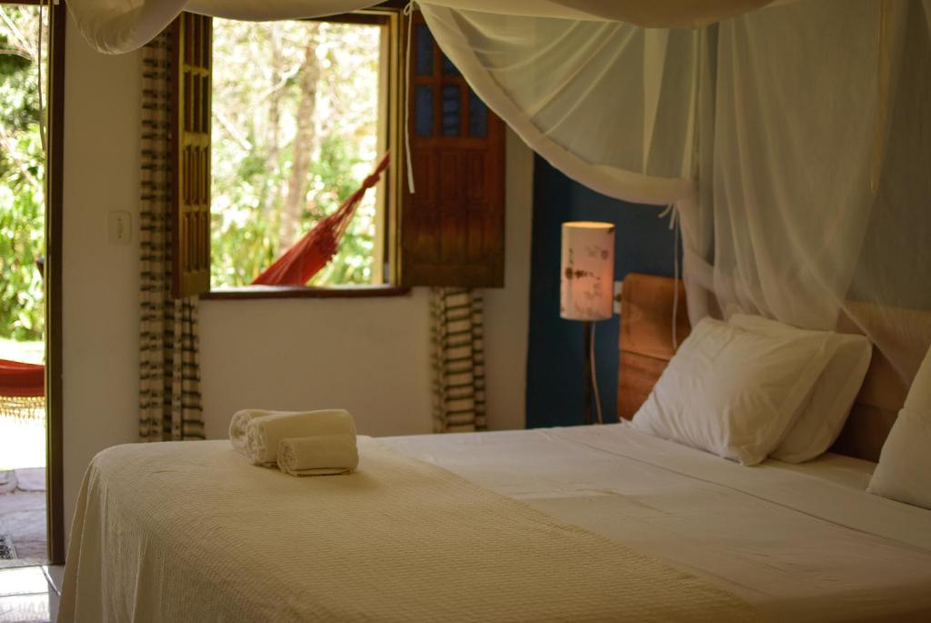 Cama ou camas em um quarto em Pousada do Capão Chapada Diamantina