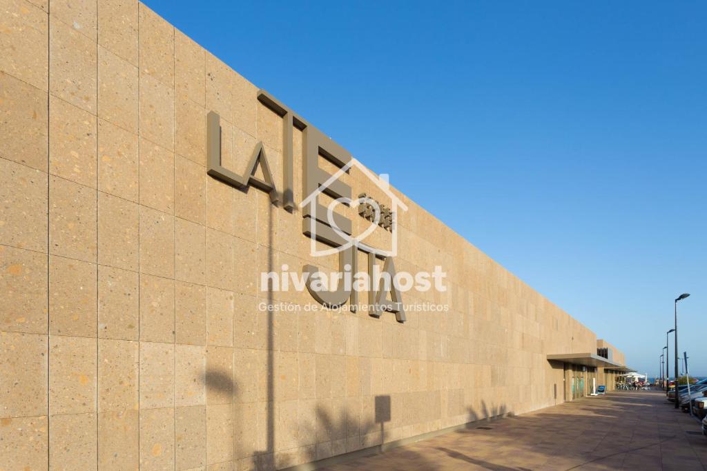 a sign on the side of a building at Sunset View La Tejita, by Nivariahost in Granadilla de Abona