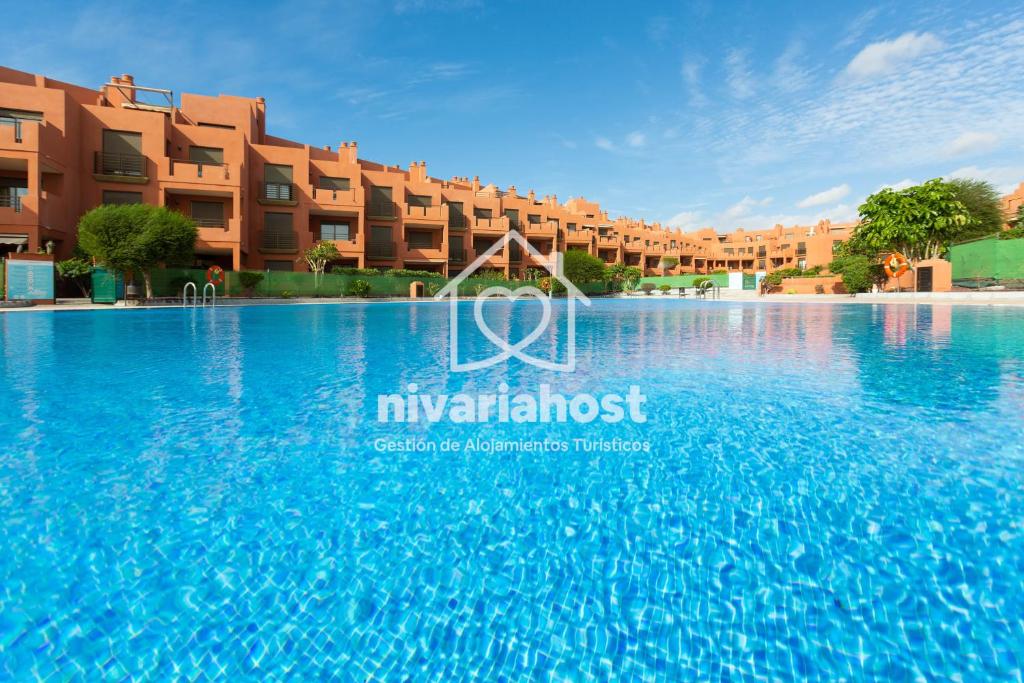 an image of the swimming pool at mykonos apartments at Sunset View La Tejita, by Nivariahost in Granadilla de Abona