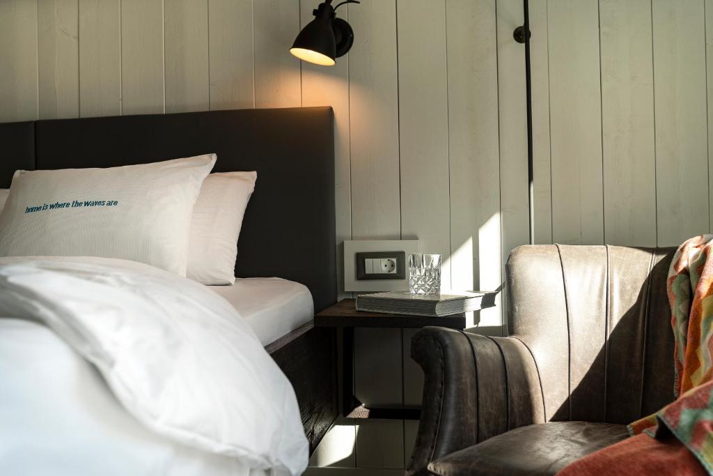Postel nebo postele na pokoji v ubytování Beach Motel St. Peter-Ording
