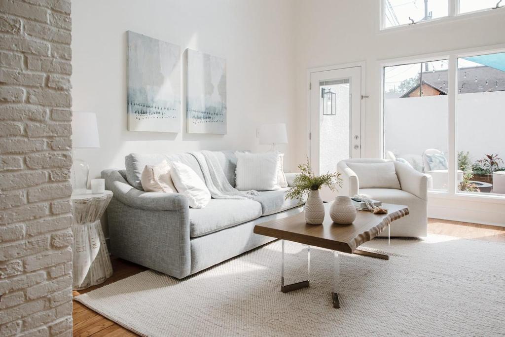 a living room with a couch and a coffee table at 29 South by Mira-Mar in Wilmington