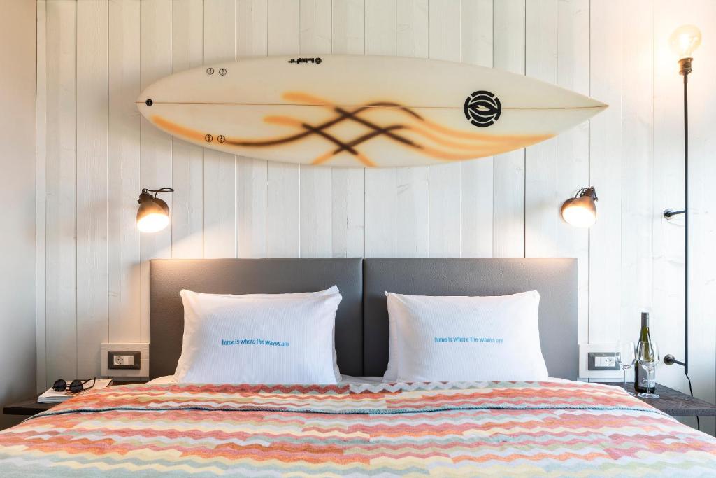 Postel nebo postele na pokoji v ubytování Beach Motel St. Peter-Ording