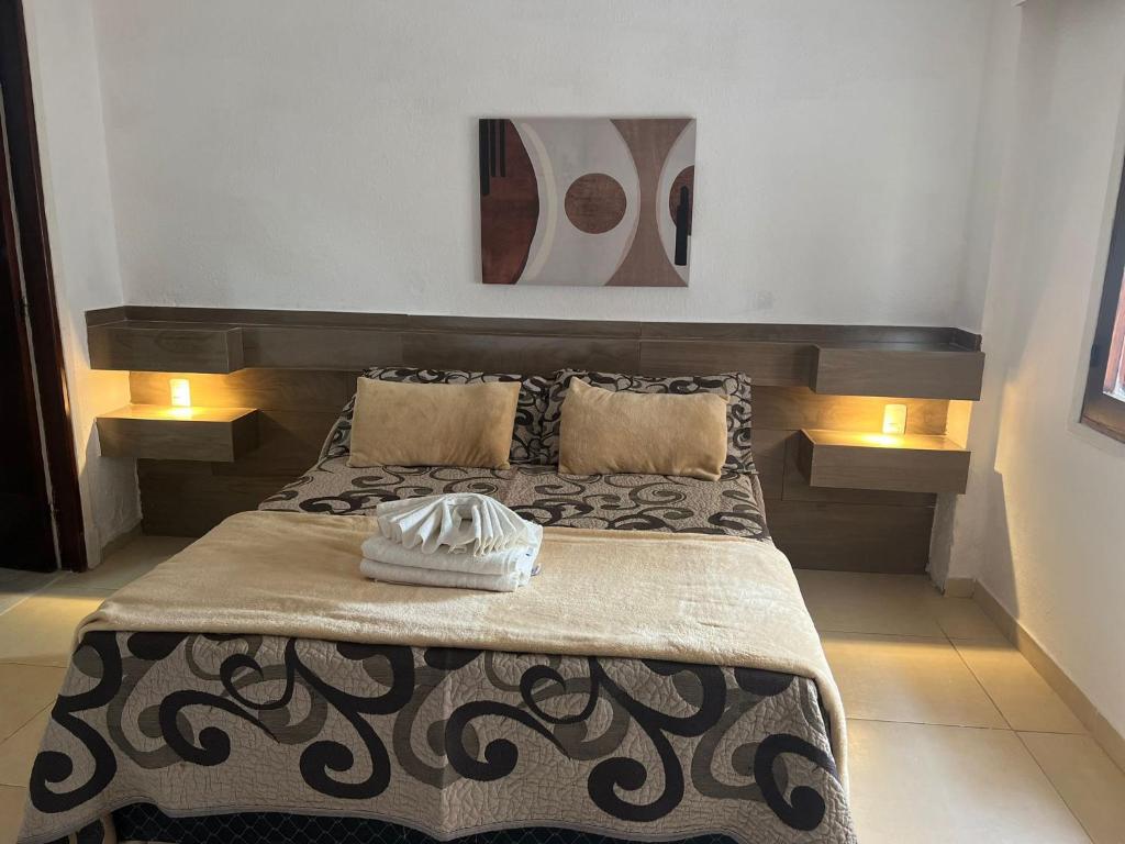 Postel nebo postele na pokoji v ubytování Hotel Lujan