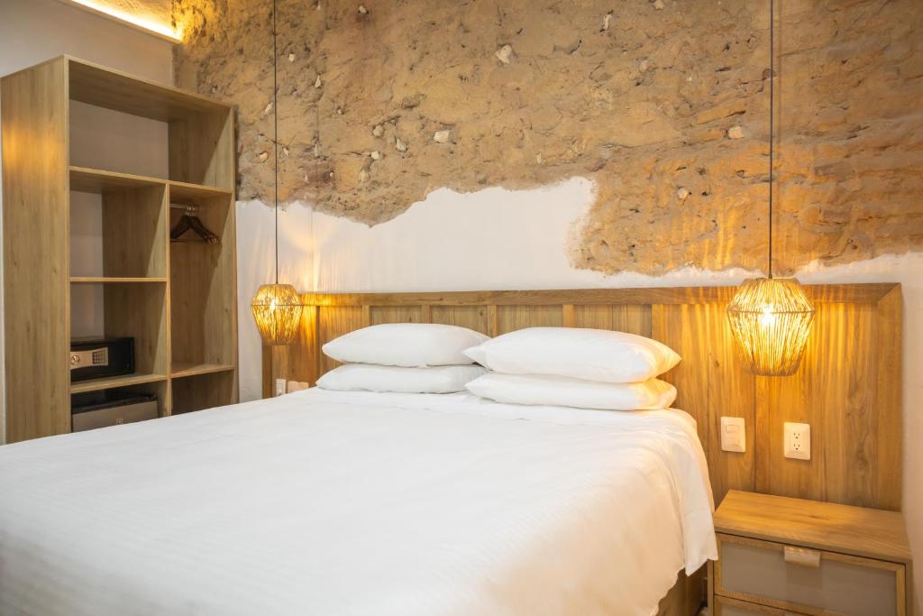 Postel nebo postele na pokoji v ubytování Hotel Casa La Mantilla by Faranda Boutique
