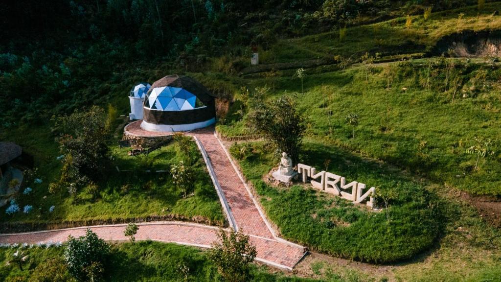 an aerial view of a house on a hill at Tybyn Geo Lodge in Arcabuco