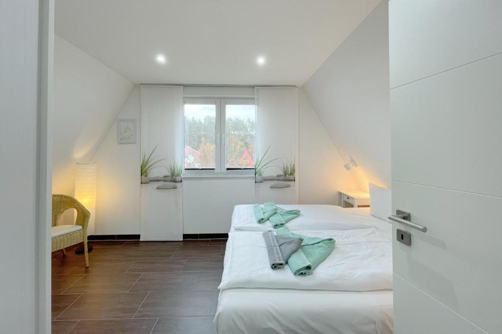 Postel nebo postele na pokoji v ubytování Ferienhaus Meeresbrise
