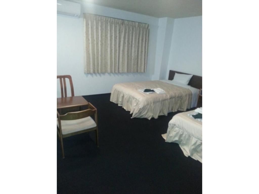 Säng eller sängar i ett rum på Business Green Hotel Youkaichi - Vacation STAY 90671v