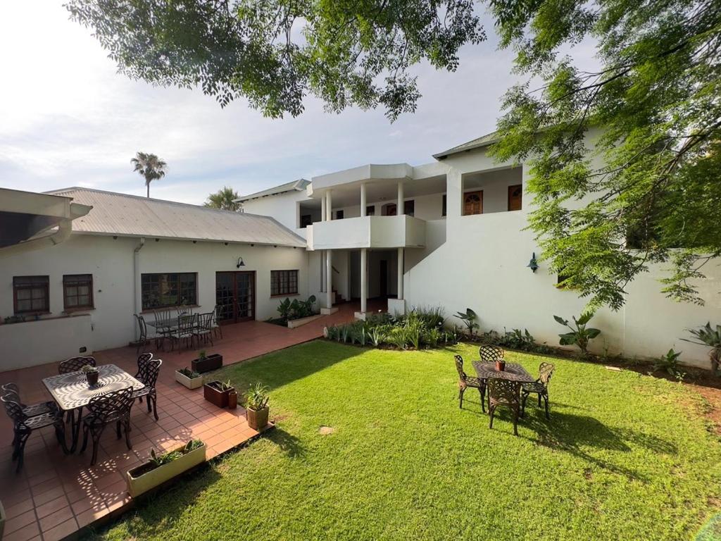 an aerial view of a house with a yard at Park Gables Loftus in Pretoria