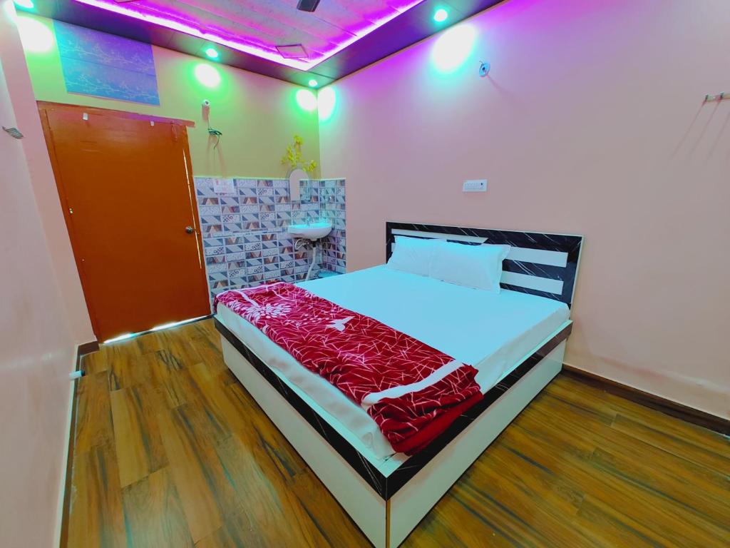 a bedroom with a bed in a room at Ayodhya Residency 5 min walking from Ram Janmabhoomi in Ayodhya