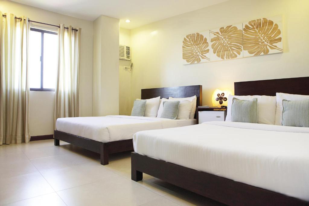 Postel nebo postele na pokoji v ubytování Alba Uno Hotel