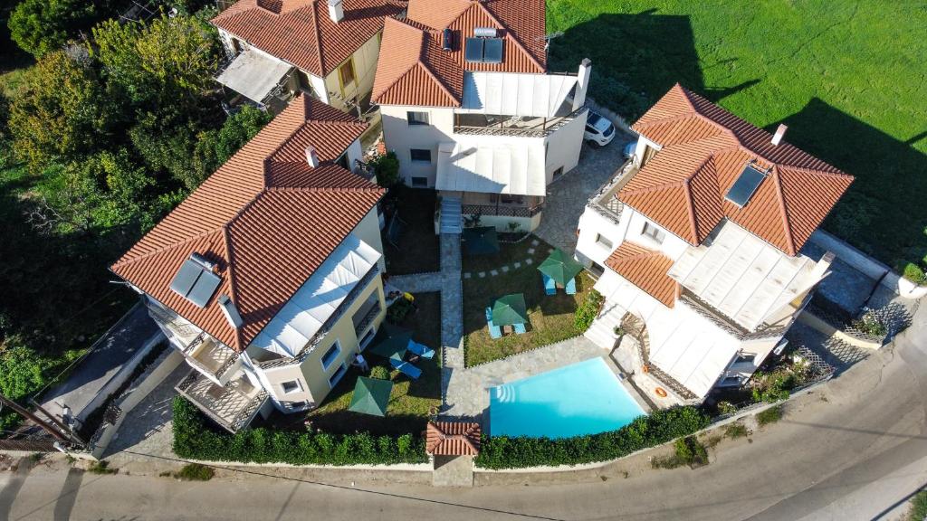 an overhead view of a house with a swimming pool at Villa Eridos in Káto Lekhónia