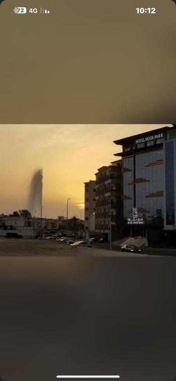 a view of a building with a fire in the distance at Hoor Hotel in Jeddah