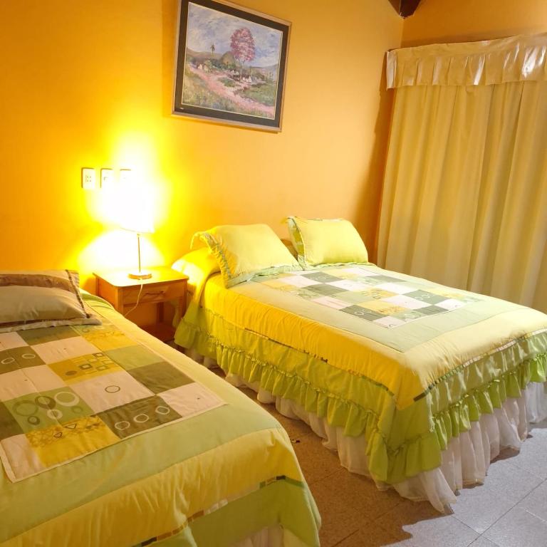 Postel nebo postele na pokoji v ubytování Hotel Santo Domingo
