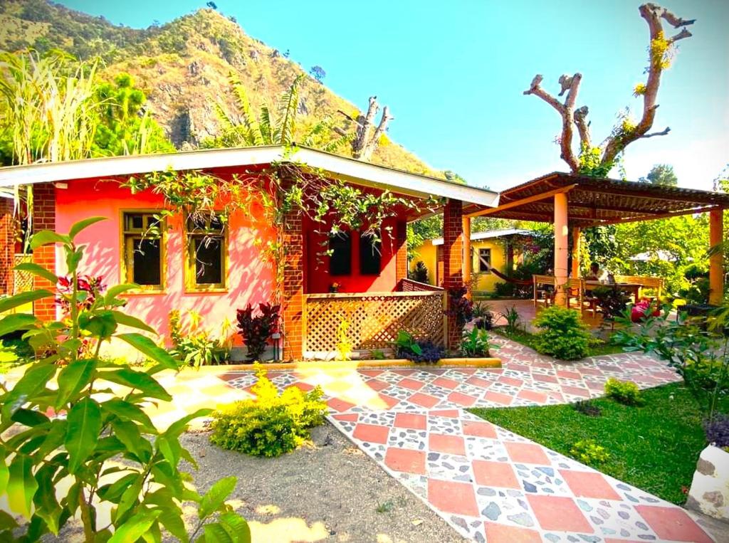 a house with a brick path in front of it at Art & Coffee in Santa Cruz La Laguna