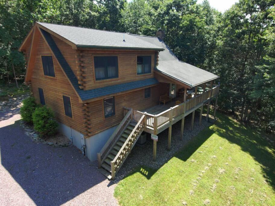 an aerial view of a log home with a porch at Mountain Maryland! Bear in the Woods in Grantsville