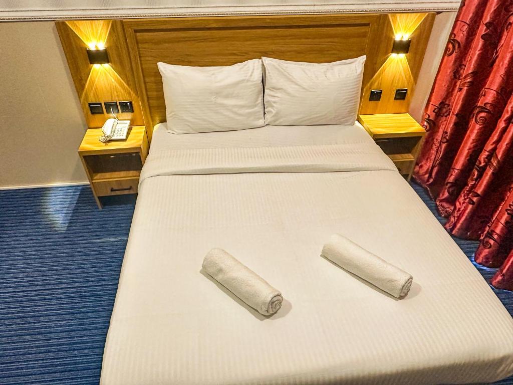 Postel nebo postele na pokoji v ubytování TAMARIND HOTEL