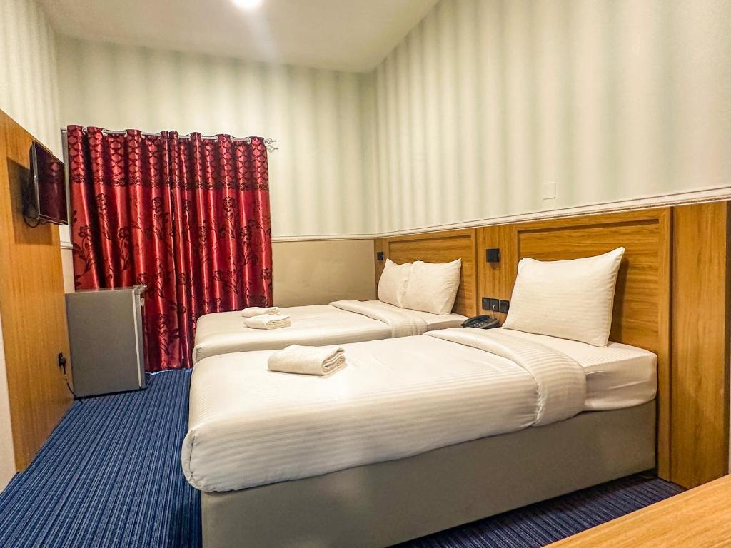 Postel nebo postele na pokoji v ubytování TAMARIND HOTEL