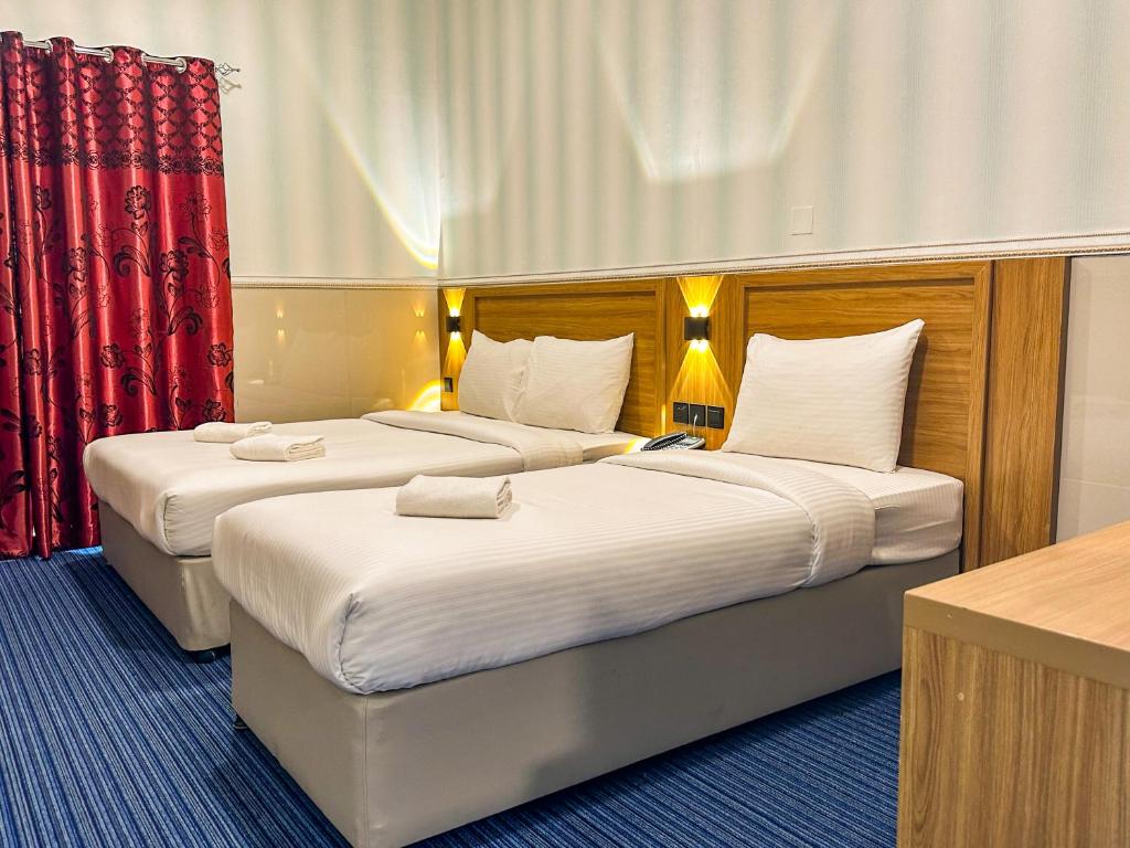 Postel nebo postele na pokoji v ubytování TAMARIND HOTEL