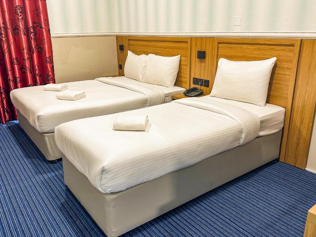 Postel nebo postele na pokoji v ubytování TAMARIND HOTEL