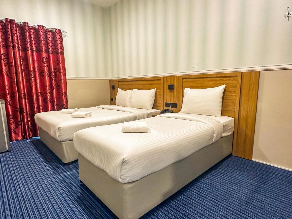 Postel nebo postele na pokoji v ubytování TAMARIND HOTEL