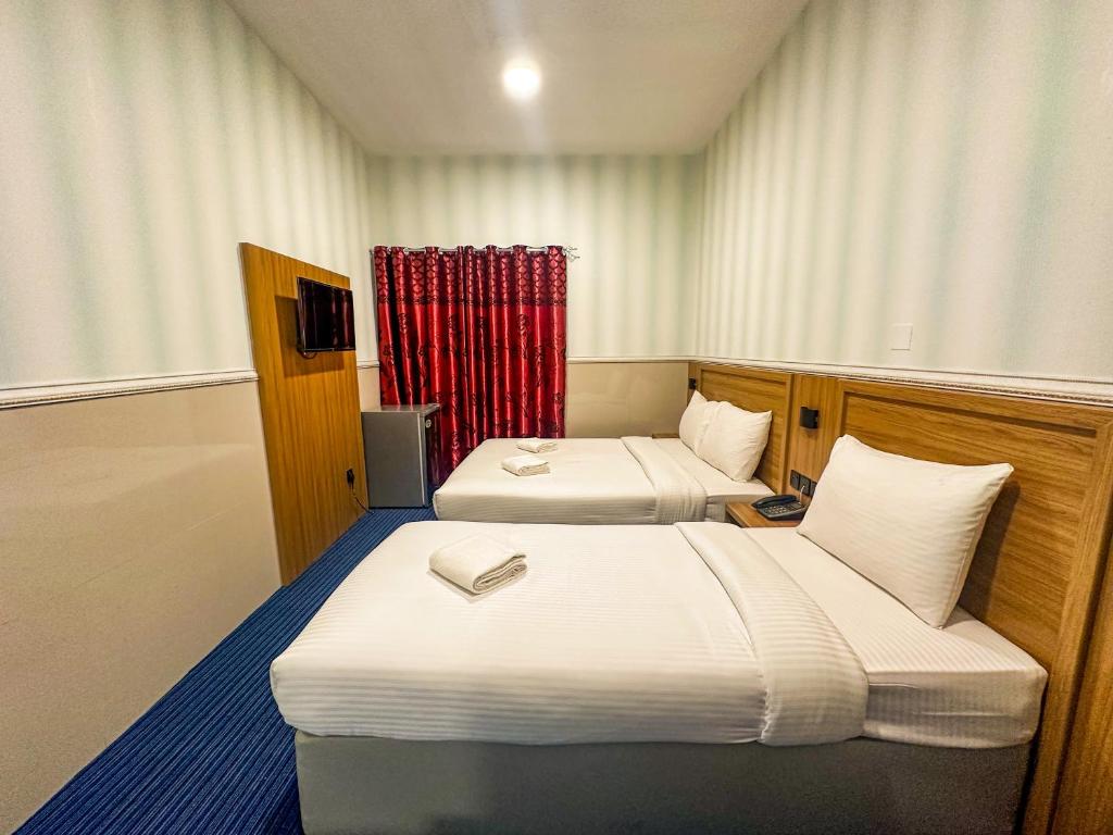 Postel nebo postele na pokoji v ubytování TAMARIND HOTEL