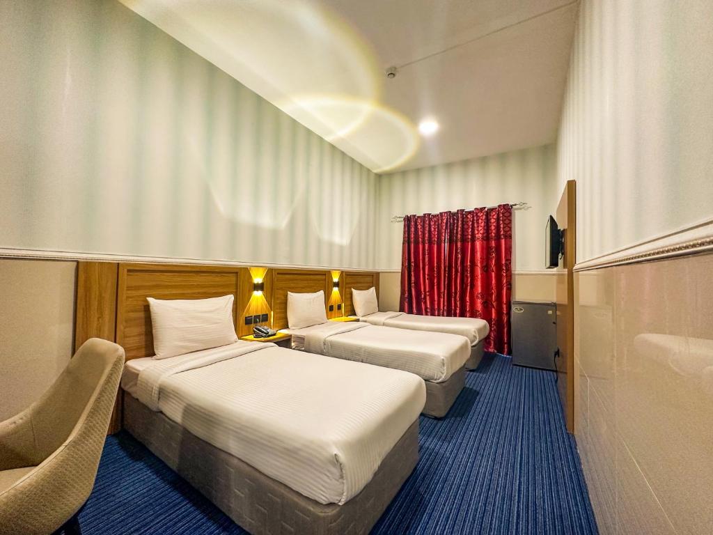 Postel nebo postele na pokoji v ubytování TAMARIND HOTEL
