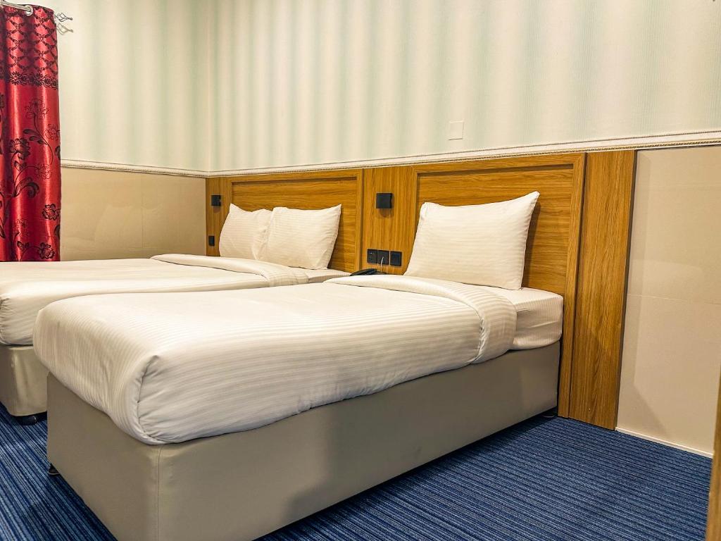 Postel nebo postele na pokoji v ubytování TAMARIND HOTEL