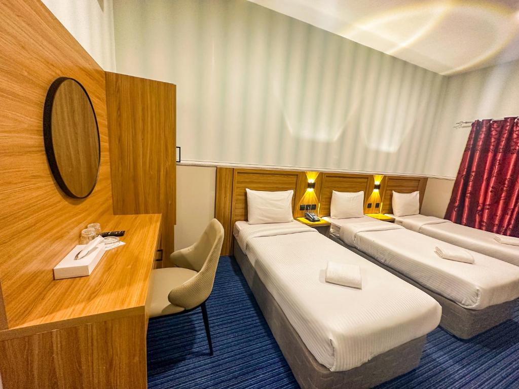 Postel nebo postele na pokoji v ubytování TAMARIND HOTEL