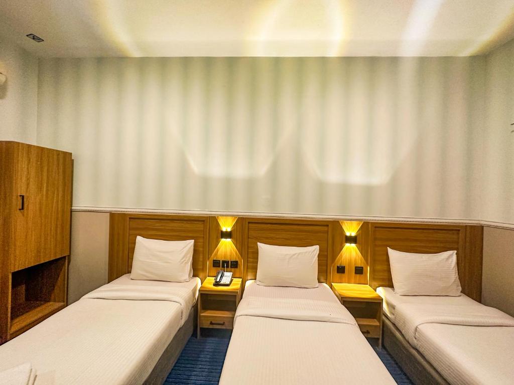 Postel nebo postele na pokoji v ubytování TAMARIND HOTEL