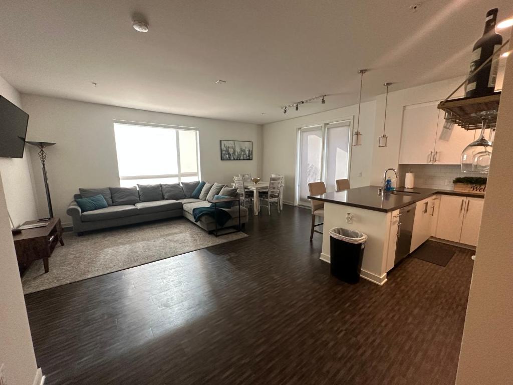 a kitchen and living room with a couch and a table at Amazing 2BD2BA located DTLA in Los Angeles