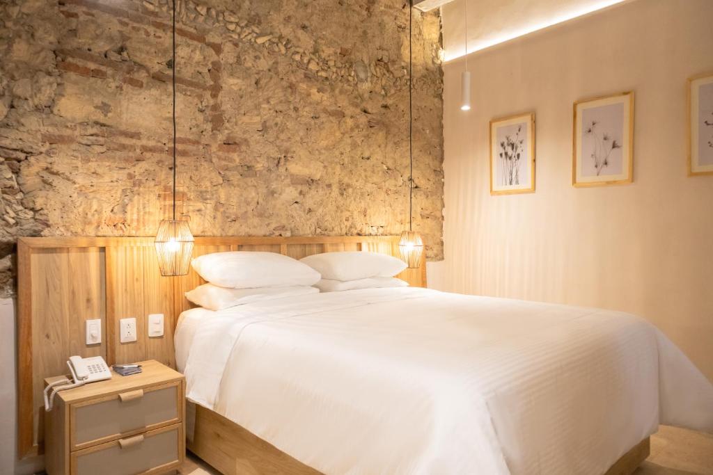 Postel nebo postele na pokoji v ubytování Hotel Casa La Mantilla by Faranda Boutique