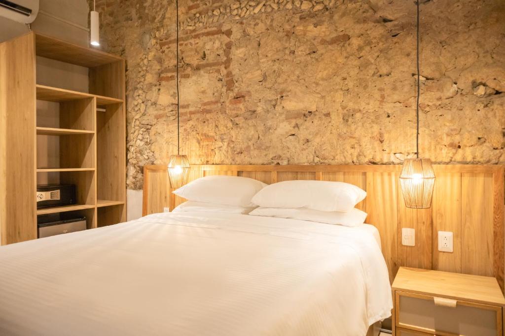 Postel nebo postele na pokoji v ubytování Hotel Casa La Mantilla by Faranda Boutique