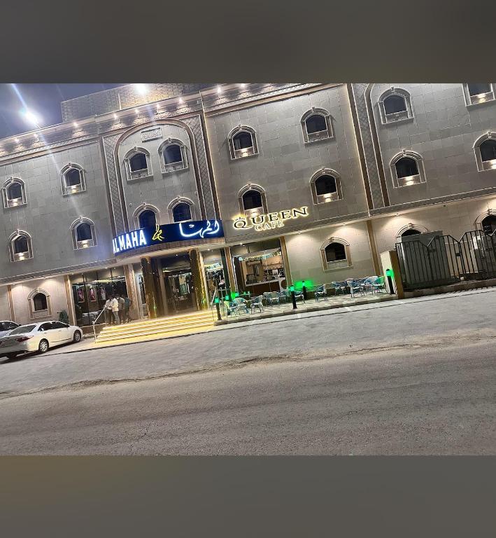 a large building on the side of a street at المها للشقق المخدومة in Al Thybiyah