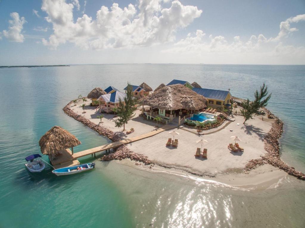 an aerial view of an island in the ocean at Little Harvest Caye - Your Own Private Island in Placencia Village