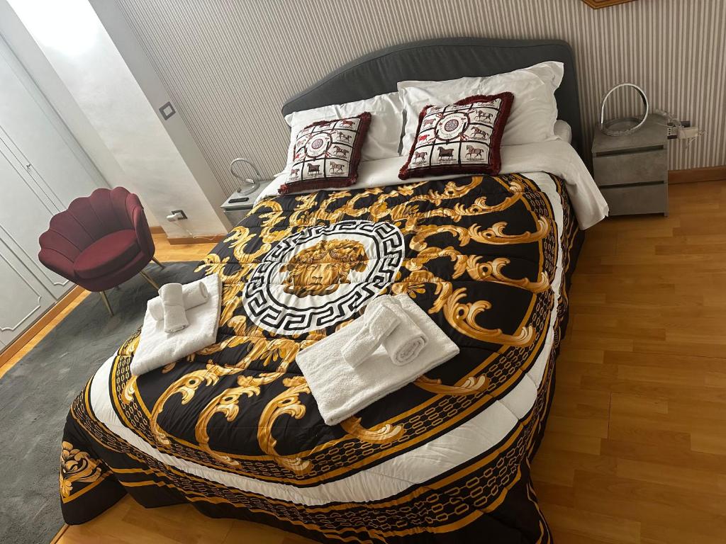 En eller flere senge i et værelse på PARIOLI LUXURY SUITe II