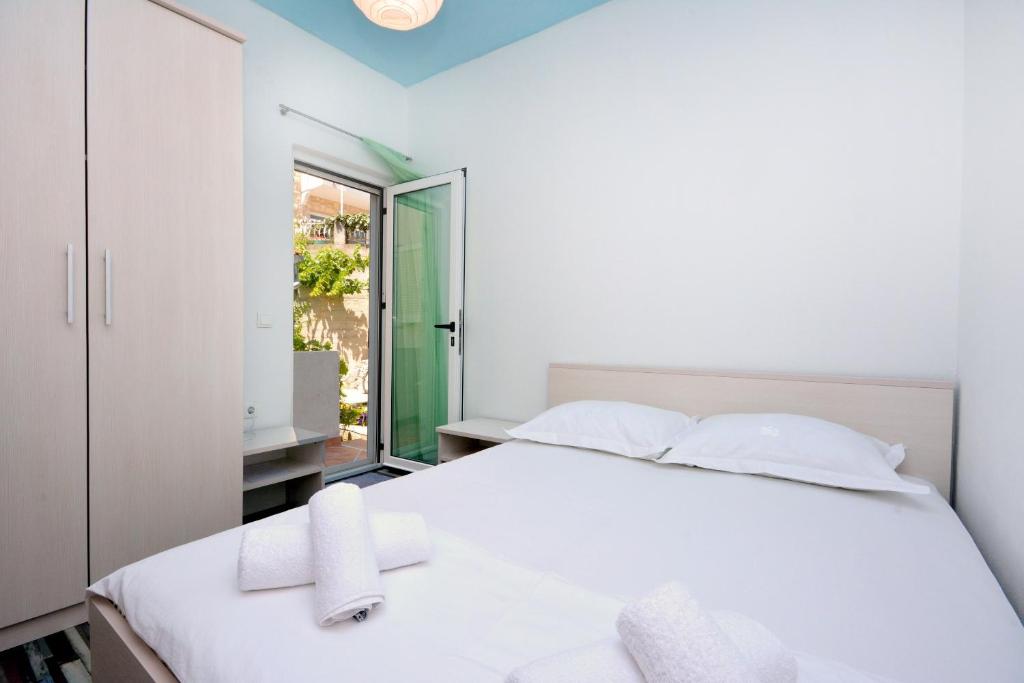 Posteľ alebo postele v izbe v ubytovaní Apartment Joe Light
