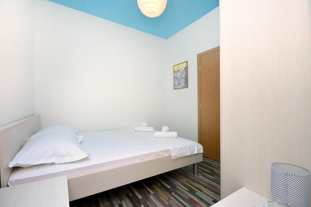 Posteľ alebo postele v izbe v ubytovaní Apartment Joe Light