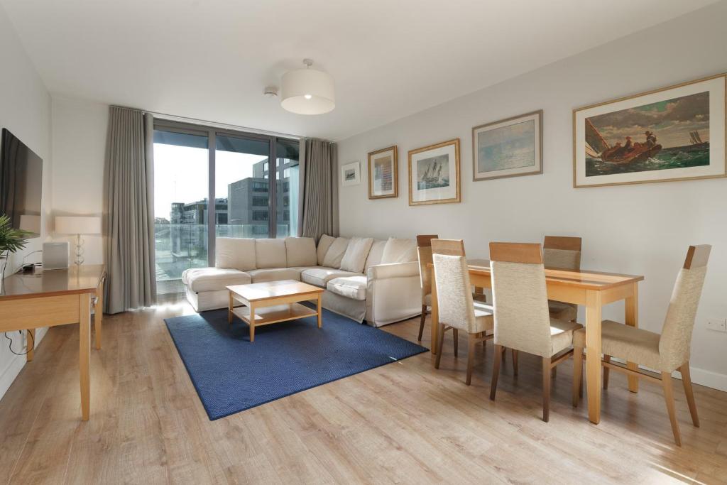 a living room with a couch and a table at Two bed apartment in Sandyford in Sandyford