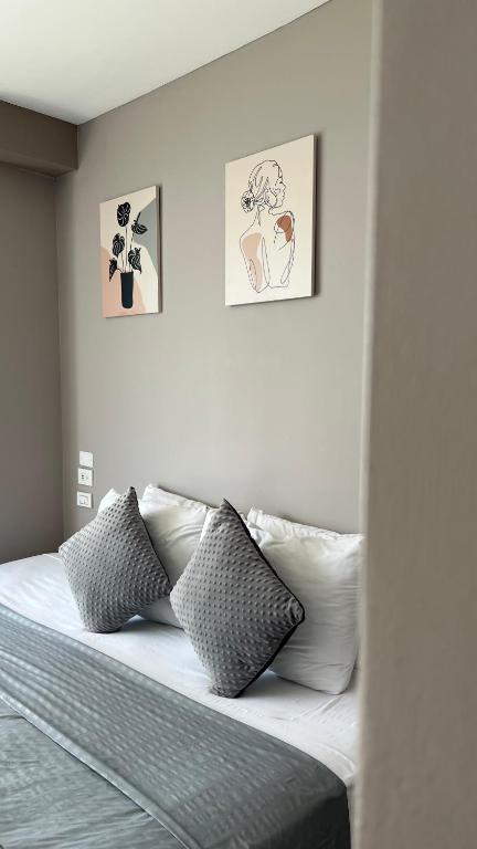 Bahia 79 Apartasuites Cerca al Centro客房内的一张或多张床位