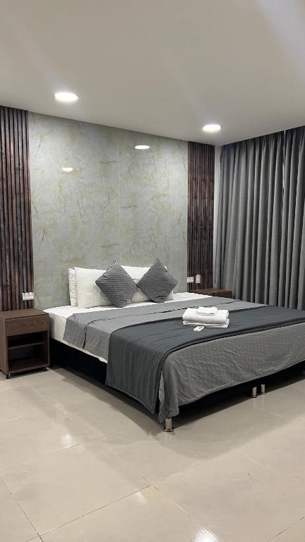 Bahia 79 Apartasuites Cerca al Centro客房内的一张或多张床位