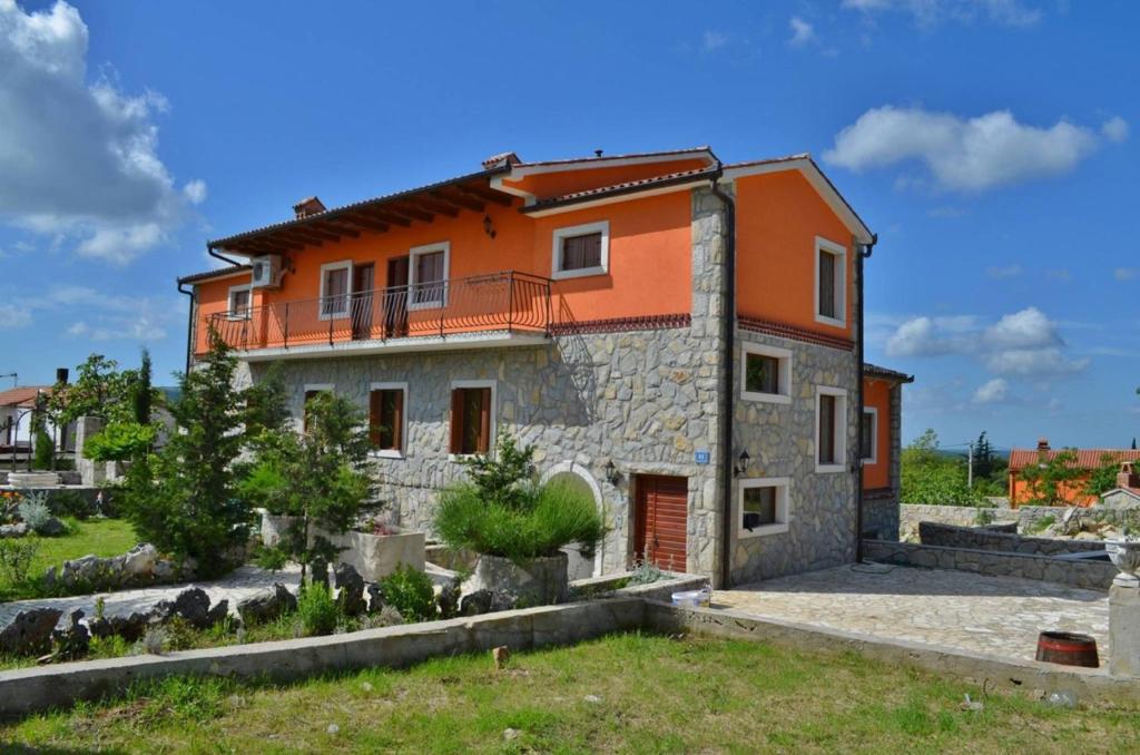 a stone house with an orange roof at B&B Morena in Labin