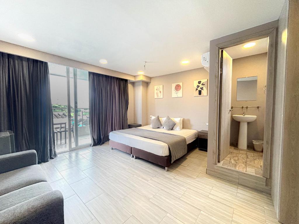 Bahia 79 Apartasuites Cerca al Centro客房内的一张或多张床位