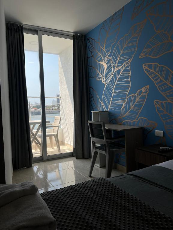 Bahia 79 Apartasuites Cerca al Centro客房内的一张或多张床位