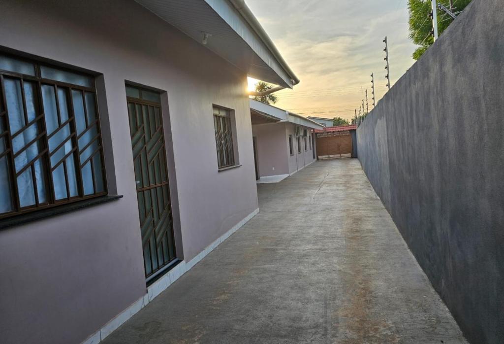 an empty hallway of a building with a fence at Apartamento boa vista RR in Boa Vista