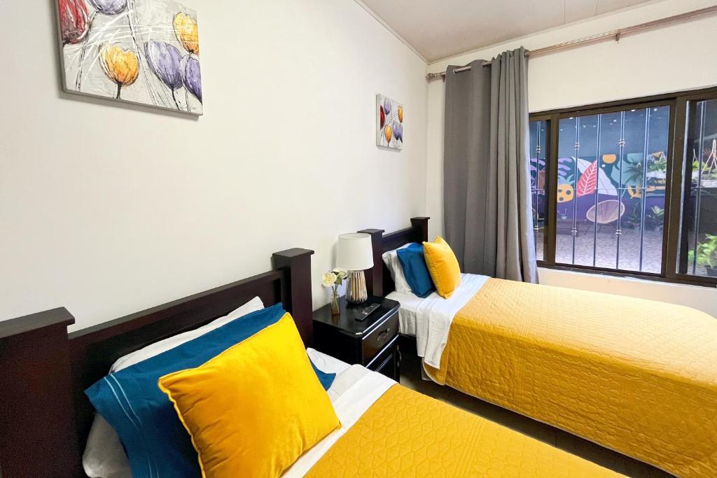 Postel nebo postele na pokoji v ubytování Viva Guest House